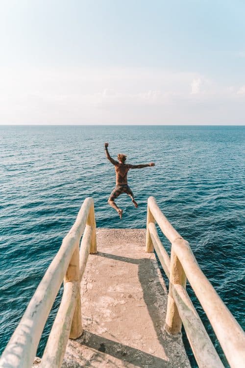 35 BEST Bohol Tourist Spots - Ultimate 2025 Guide 52 cliff diving in bohol, cliff dive bohol, alexis cliff dive resort bohol, cliff jumping bohol, cliff jumping panglao, cliff diving panglao, alexis cliff dive resort, molave cove cliff dive, molave cove, molave cliff diving resort