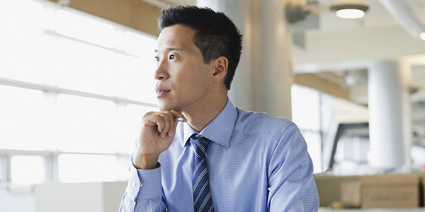 man in office thinking 