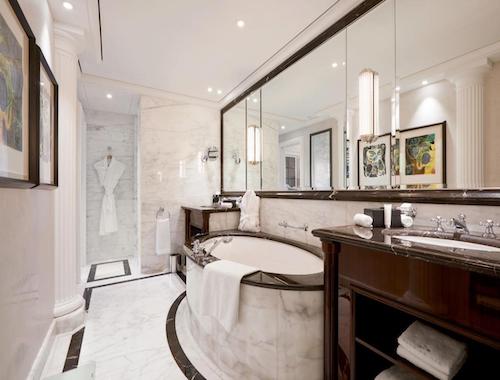Elegant bathroom with marble and round tub