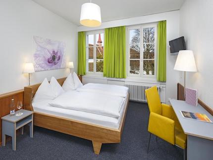 Basic and clean bedroom at Hotel Restaurant Stern Luzern