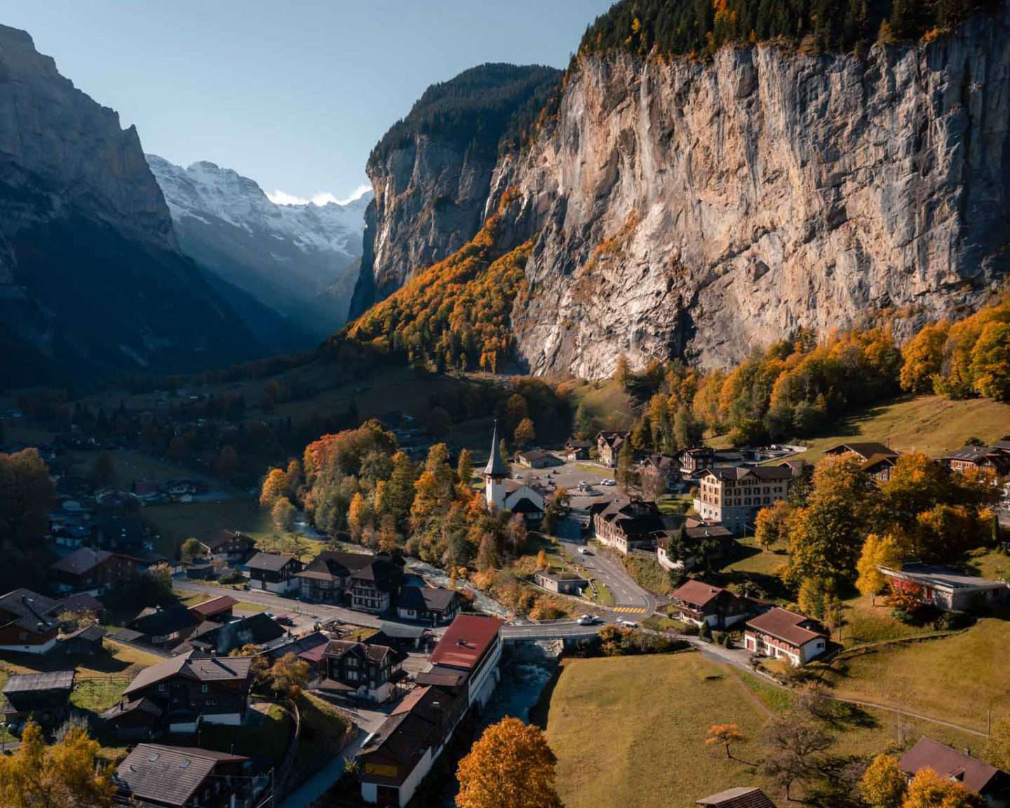 Lauterbrunnen in autumn with orange tree foliage