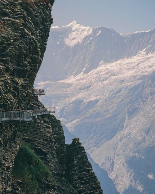 20 BEST Things To Do In Lauterbrunnen (2025 GUIDE) 24 Via ferrata, cliff walk in Grindelwald with people on ledge