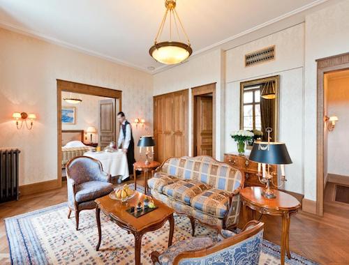 Classic-style hotel suite with vintage furniture and wooden decor
