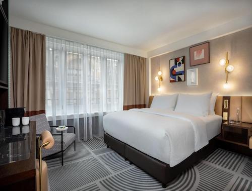 Cozy bedroom with large windows in Zurich